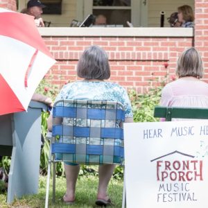 Neighbors listening to music at a front porch