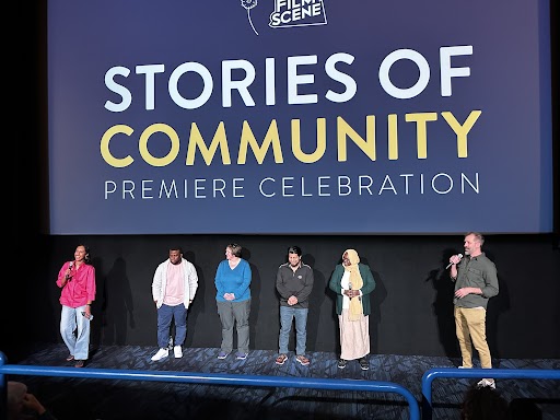 Stories of Community Community leaders standing in a conversation panel at FilmScene